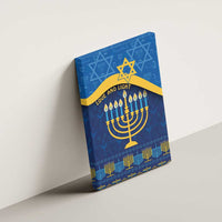 Blue Hanukkah canvas wall art mounted on a wall with menorah candles and Star of David.