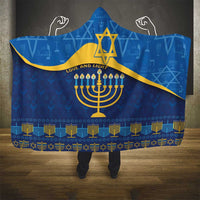 Blue hooded blanket with menorah and Star of David motif, patterned border