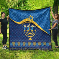 Blue Hanukkah quilt featuring yellow Star of David, menorah candles, and 'LOVE AND LIGHT'