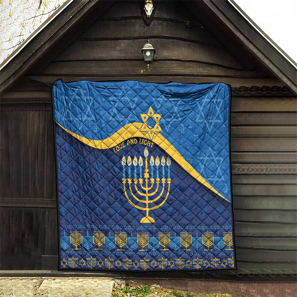 Blue Hanukkah quilt displayed on wooden wall with yellow Star of David and menorah