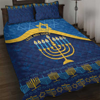 Blue Hanukkah quilt bed set with gold menorah, Star of David, and geometric border