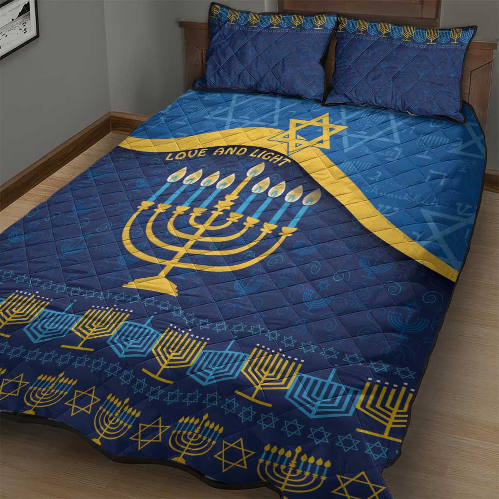 Blue Hanukkah quilt bed set featuring gold menorah, candles, and decorative border