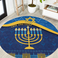 Blue round Hanukkah carpet, gold menorah and “Love and Light” lettering