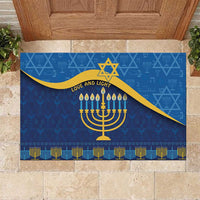Blue Hanukkah rubber doormat with menorah, Star of David, and gold "Love and Light" text