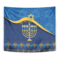 Blue Hanukkah tapestry close-up with gold menorah, Star of David, and patterned border