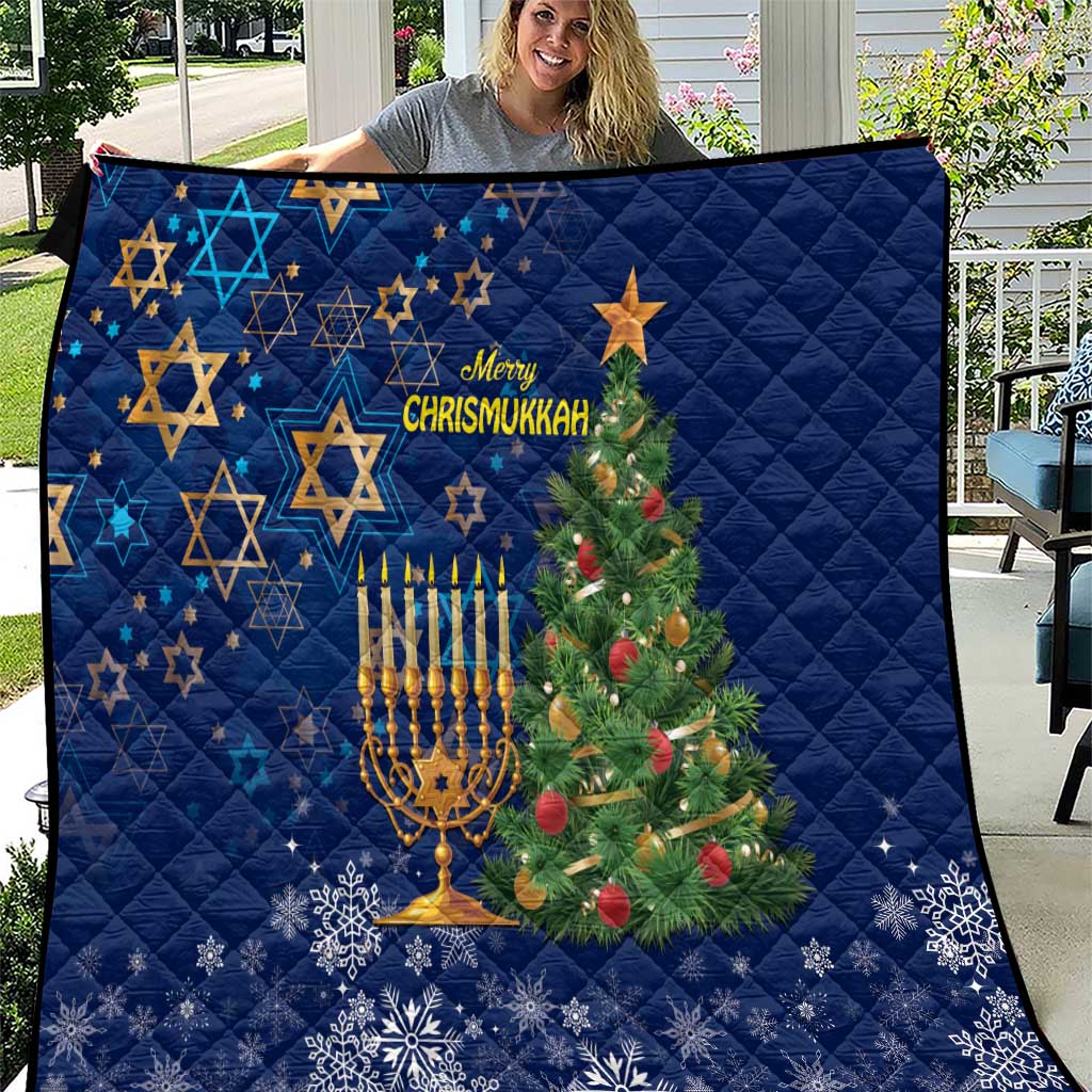 Blue quilt with star patterns, menorah, Christmas tree and Merry Chrismukkah lettering