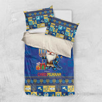 Blue bedding set flat lay with gnome print, menorah, and matching patterned pillowcases