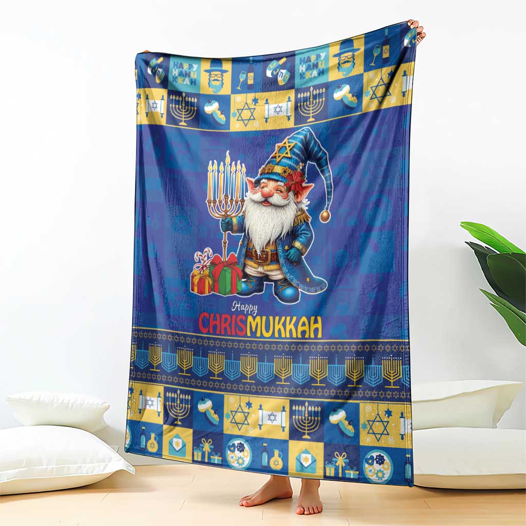 Blue blanket featuring a gnome holding gifts, menorah patterns, and “Happy Chrismukkah”