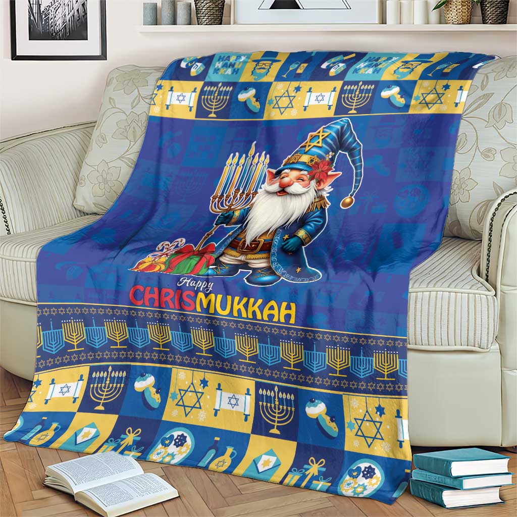 Blue blanket with gnome in a hood, menorah and star motifs, and “Happy Chrismukkah”