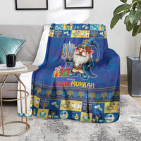 Blue holiday blanket with gnome, menorah strip border, and “Happy Chrismukkah” on center