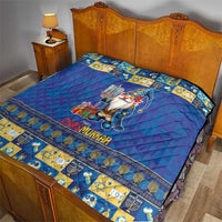 Blue quilt on bed with gnome holding a menorah, “Chrismukkah” text, and patterned border