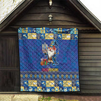 Blue quilt hung indoors with gnome holding menorah, “Chrismukkah” text, and decorative border