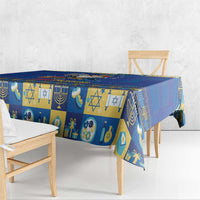 Blue tablecloth with repeating Hanukkah icons, crescent and candle pattern