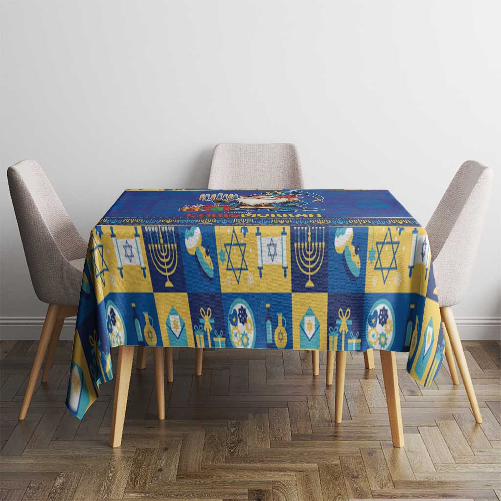 Blue tablecloth with block-style Hanukkah symbols, menorah, star, and candle designs