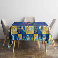 Blue tablecloth with block-style Hanukkah symbols, menorah, star, and candle designs