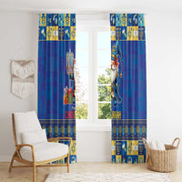 Blue curtain panels with gold border and gnome artwork on both sides of a window.