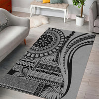 Black and white geometric area rug with large circular medallion, angled stripes