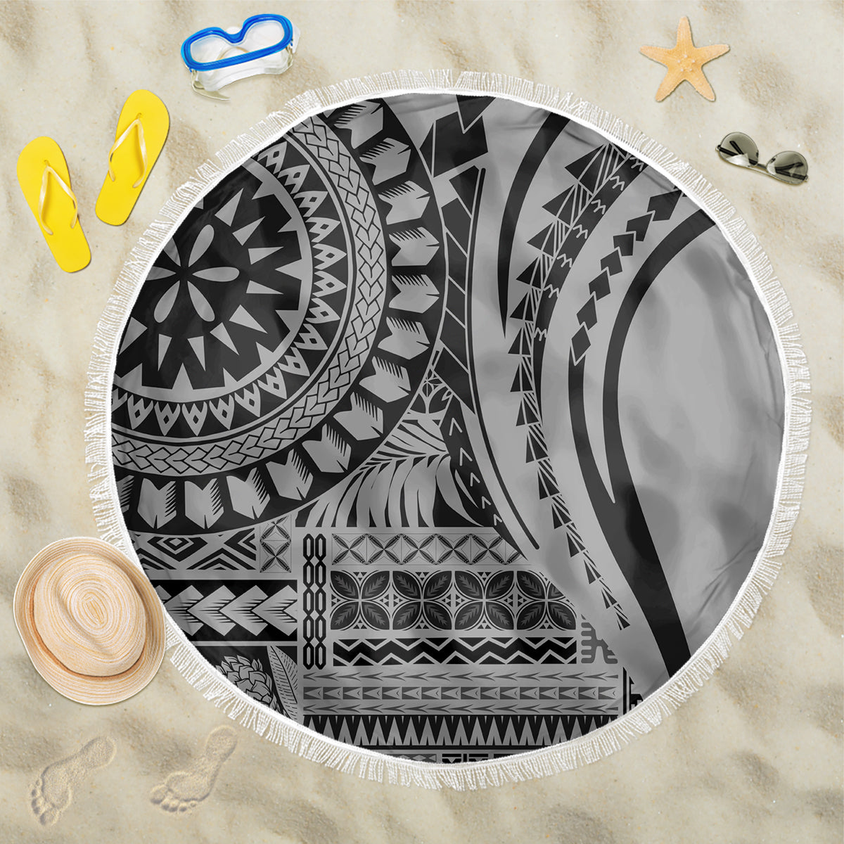 Black and white circular beach blanket with tribal geometric pattern and white fringe