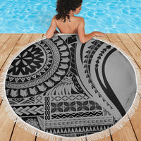 Black and white round beach blanket with tribal geometric pattern and white fringe edge