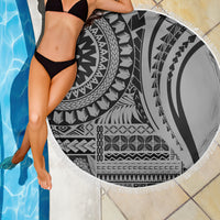 Black and white circular beach blanket with tribal pattern and white fringe border
