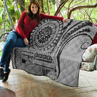 Black and white quilt with circular mandala design and crescent moon pattern