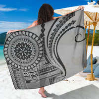 Black and white Samoa siapo sarong with circular motif and geometric patterns, draped