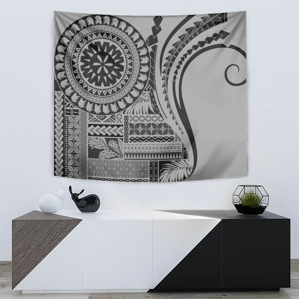 Black and gray siapo-style tapestry with circular medallion and abstract border patterns