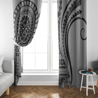 Black and white window curtains framing glass panels with mandala and curved stripe motifs