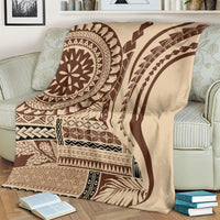 Brown and cream patterned art blanket with circular medallion and curved geometric bands