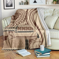 Brown and cream geometric art blanket with bold circular motif and zigzag borders