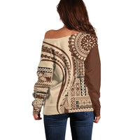 Back view off-shoulder sweater, brown and cream tribal geometric pattern, long sleeves