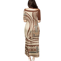 Brown long dress with geometric motifs and short sleeves, back view