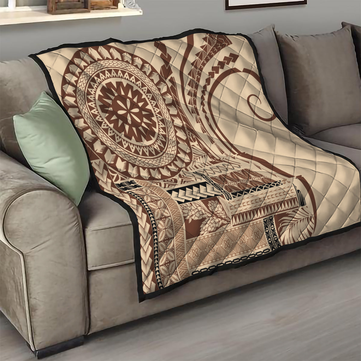 Brown and cream Samoa Siapo-style quilt with sun medallion and tribal blocks on couch
