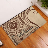 Brown and cream patterned rubber doormat with circular tribal medallion