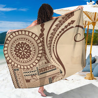 Brown and cream patterned sarong with bold circular and geometric motifs, draped