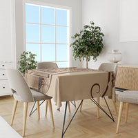 Brown and tan patterned tablecloth with circular swirl motif and geometric banding