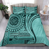 Turquoise bedding set with duvet and two pillow shams featuring geometric tribal print