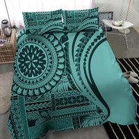 Turquoise duvet cover and shams with large black tribal circle and arch patterns