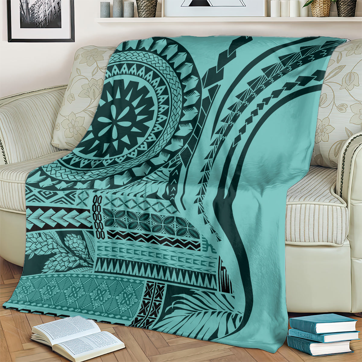 Turquoise patterned throw blanket on sofa with black circular mandala and stripe motifs
