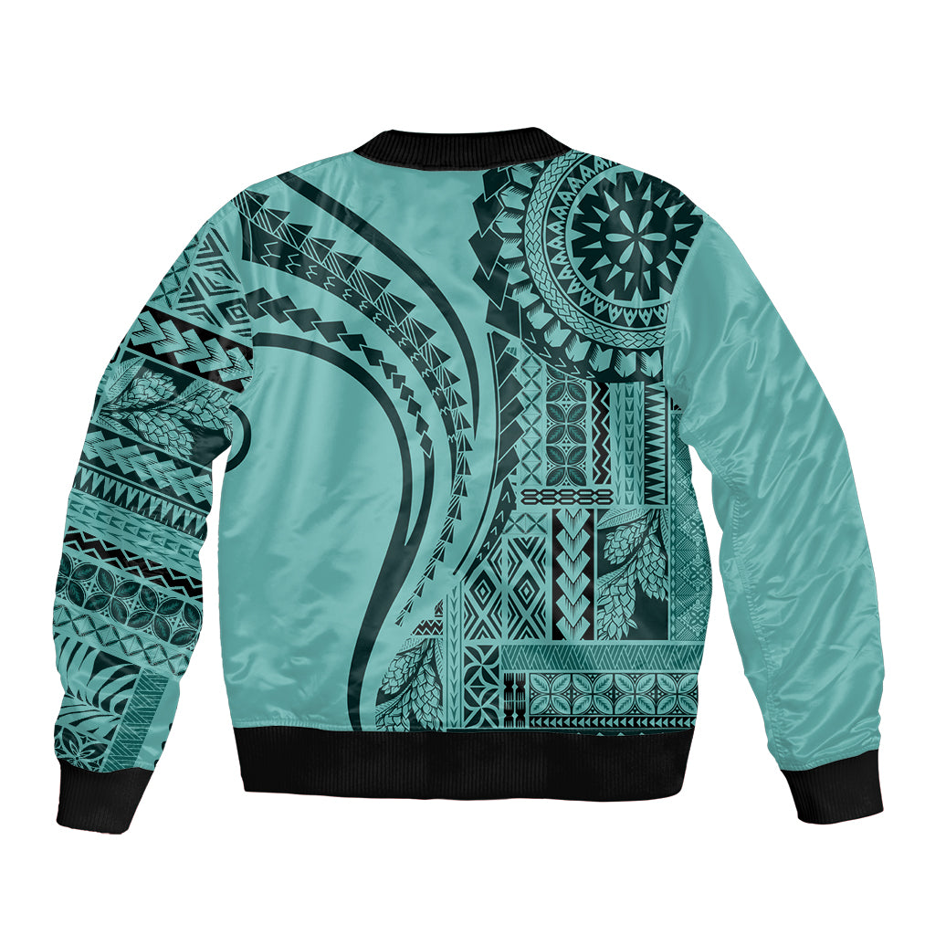 Turquoise bomber jacket with large Polynesian artwork, black ribbed collar and hem