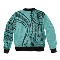 Turquoise bomber jacket with large Polynesian artwork, black ribbed collar and hem