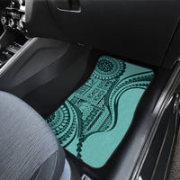 Turquoise patterned car floor mat on front passenger footwell
