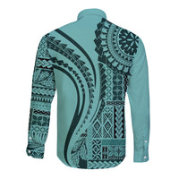 Turquoise long-sleeve button shirt with dark tribal print on back