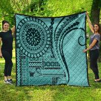 Turquoise Samoa-style siapo quilt with large mandala, wave and diamond motifs, quilted