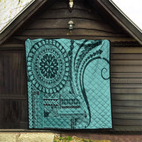 Turquoise quilt with mandala medallion and tribal panels, quilted texture, hanging display