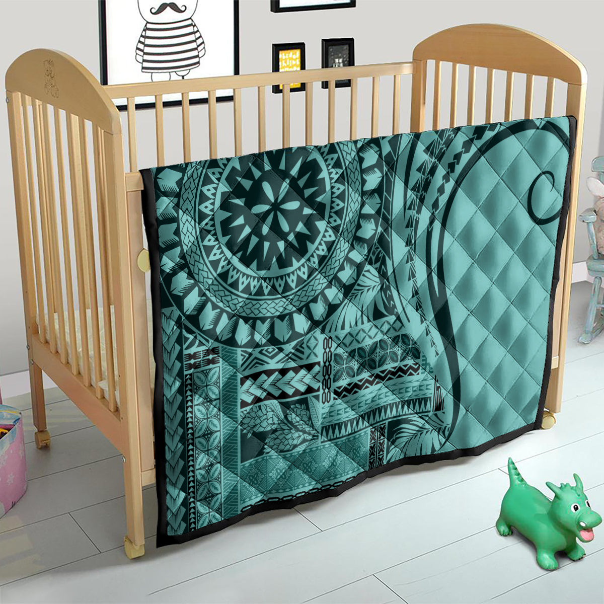 Turquoise quilt in a crib, quilted with mandala medallion and tribal stripe panel