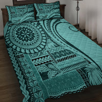 Turquoise quilt bed set with large circular medallion, leaf and stripe patterns, two pillows