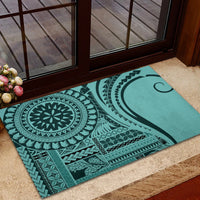 Turquoise rubber doormat with tribal pattern, circular motif, and curved wave design