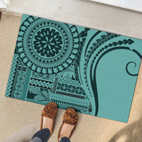 Turquoise rubber doormat with tribal medallion, arrows, and leaf-like motifs