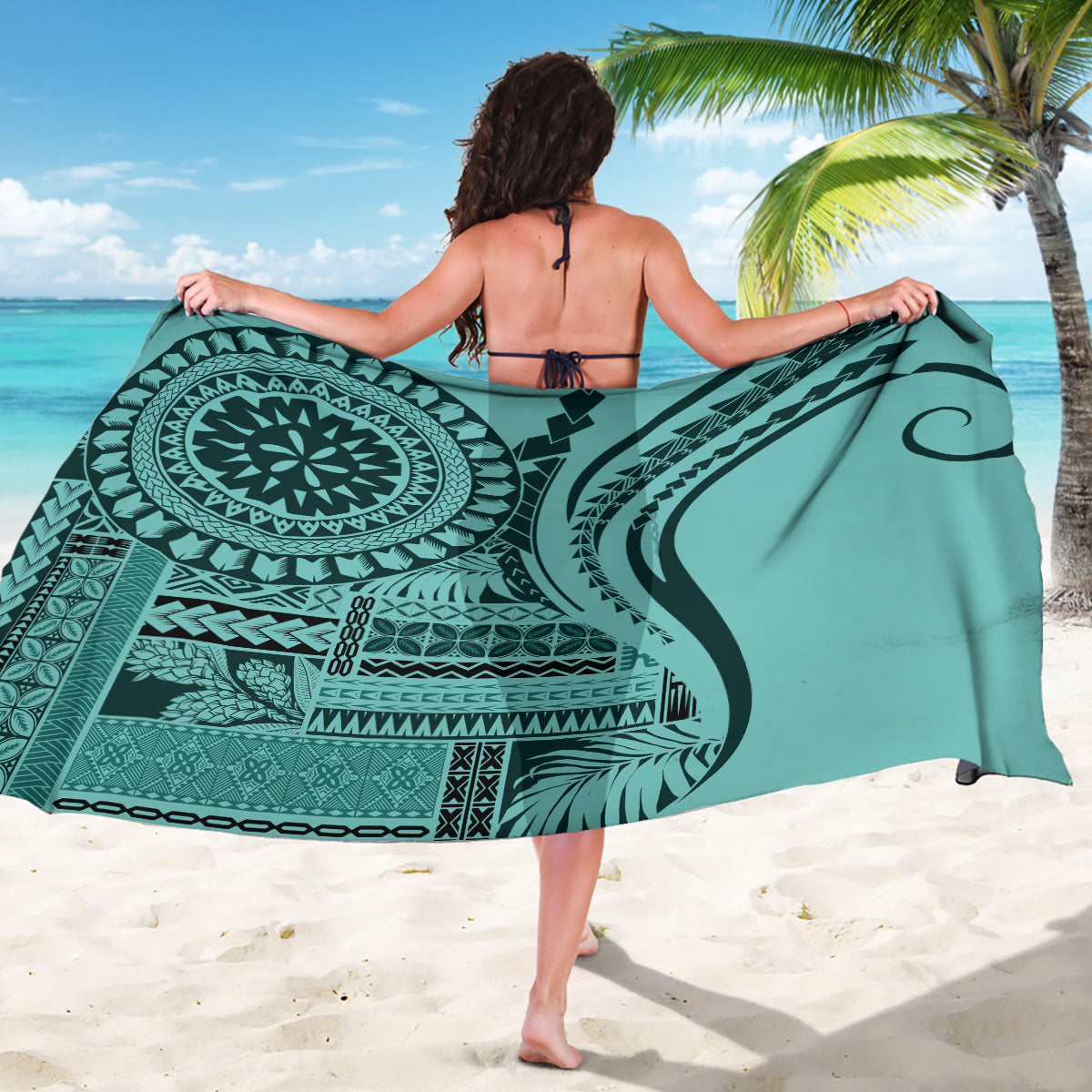 Turquoise sarong with large circular motif and tribal geometric print, draped wrap